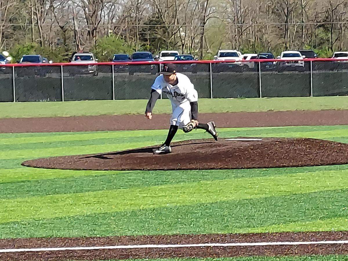 Highland starting pitcher Matt Miscik finishes a pitch during a Mississippi Valley Conference game Thursday, April 14, against Mascoutah at Triad High School. The Bulldogs held off a late Indians rally to prevail 9-8.