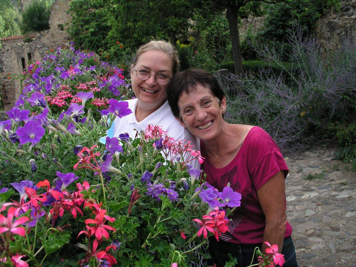 Mary Wilson, left, poses with her pen pal, Annie Almoguera, while sightseeing in an historic French village in 2015, when Mary went to France for the first time.