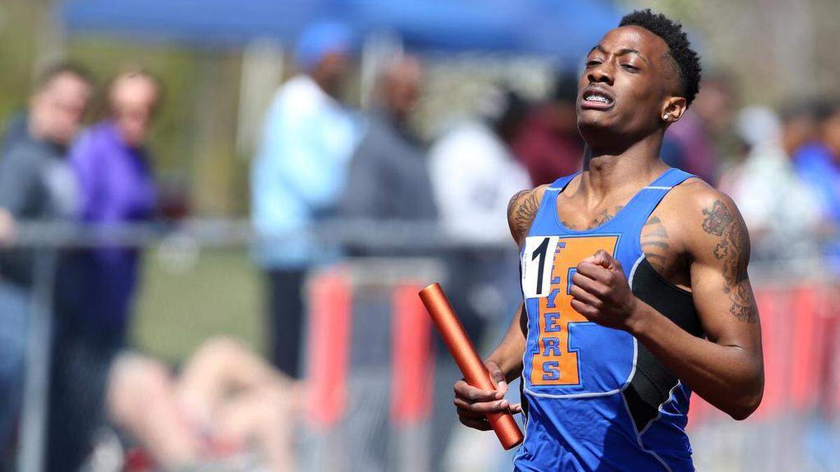 In this March 2016 file photo, East St. Louis’ Sanchez Rhodes heads for the finish of the 4 by 800 relay at the 2016 Southwestern Illinois Relays hosted by Edwardsville High School. Rhodes was shot and killed on Saturday.