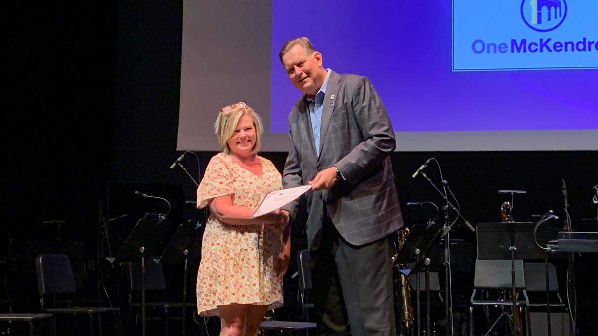 Anita Gentry of Breese receives the President’s Award for Professional Excellence from President Daniel C. Dobbins ’81 of McKendree.