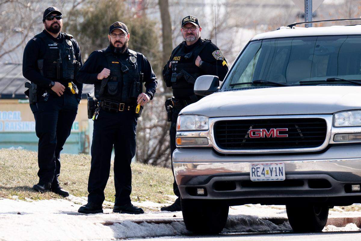 Overland Police help escort roughly 100 community members marching to protest President Donald Trump’s policy changes around immigration on Saturday, Jan. 25, 2025, in Overland.