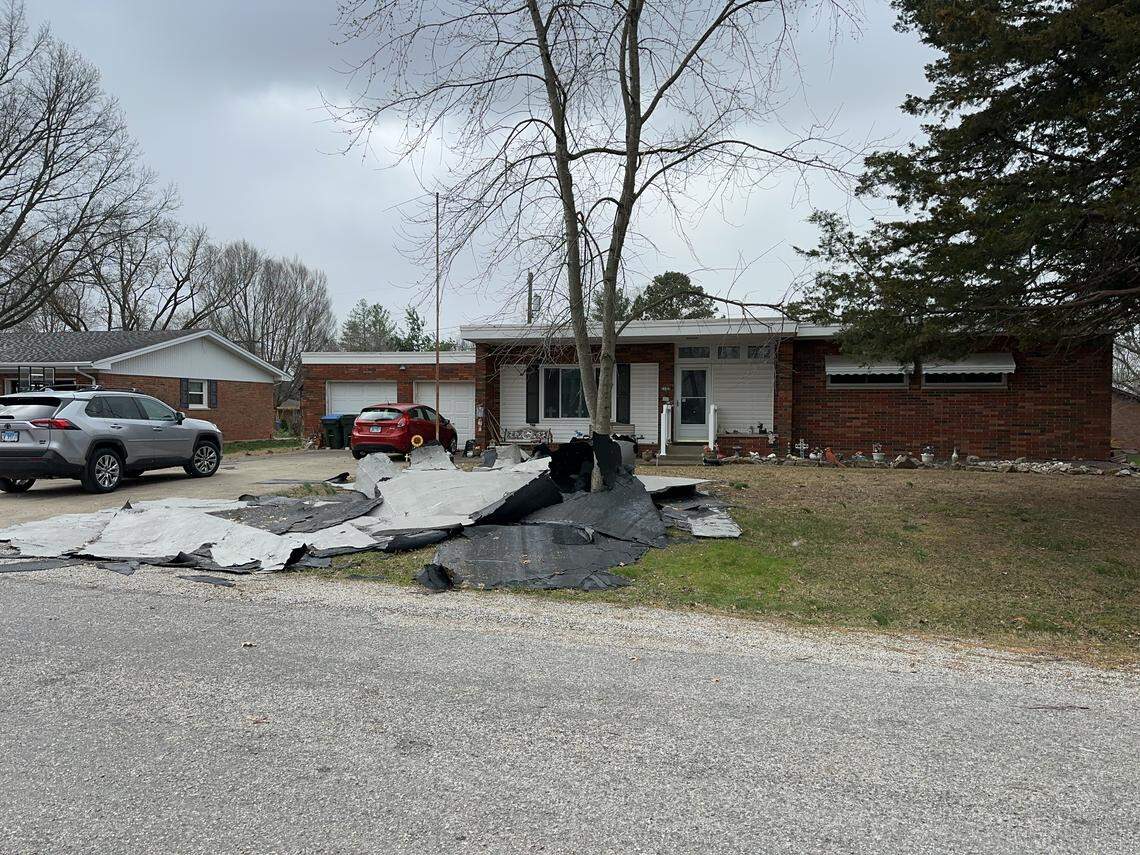 A March 15, 2026, tornado damaged buildings in New Athens. One home’s roof covering was blown off.