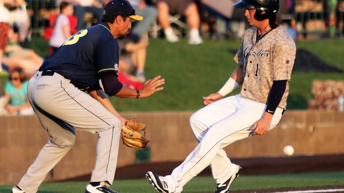 Gateway’s Cody Livesay pulls into third base standing up ahead of the throw as the Traverse City’s Beach Bums’ Jose Vargas awaits the ball. Gateway won 4-3. See a gallery of photographs at bnd.com.