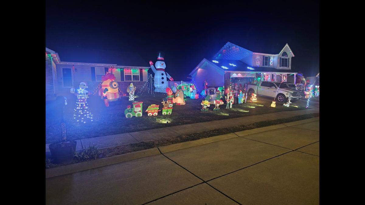 Brian Evans’ holiday lights display features an inflatable Minion, a big snowman and more.