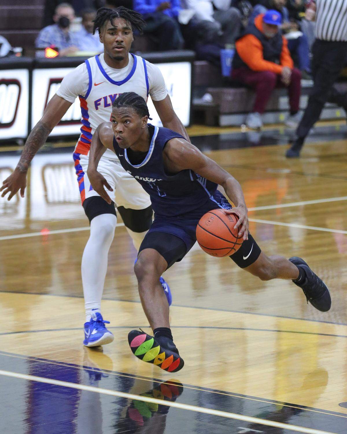 Belleville East’s Jordan Pickett drives to the basket during Tuesday night’s Southwestern Conference game against East St. Louis. The Flyers ultimately prevailed 72-71.
