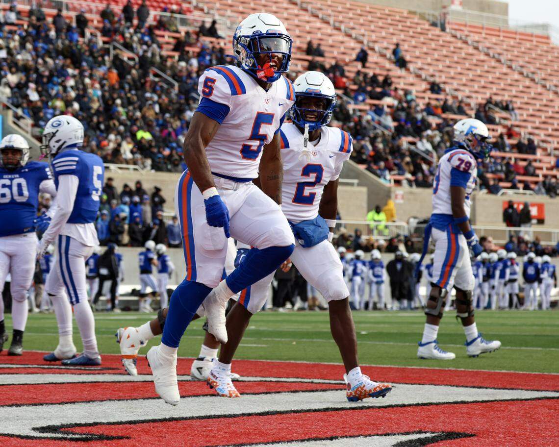 East St. Louis’ Larevious Woods celebrates the first of his three touchdowns during the Illinois Class 6A championship game against Geneva at Hancock Stadium on the campus of the Illinois State University.