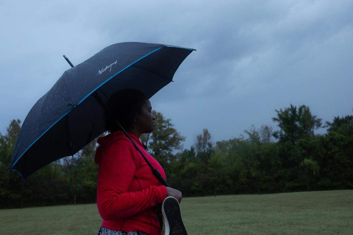 An observer closes her eyes to feel a spiritual connection at a Fall Equinox observation ceremony in Cahokia Heights National Historic Site on Sept. 22, 2024.