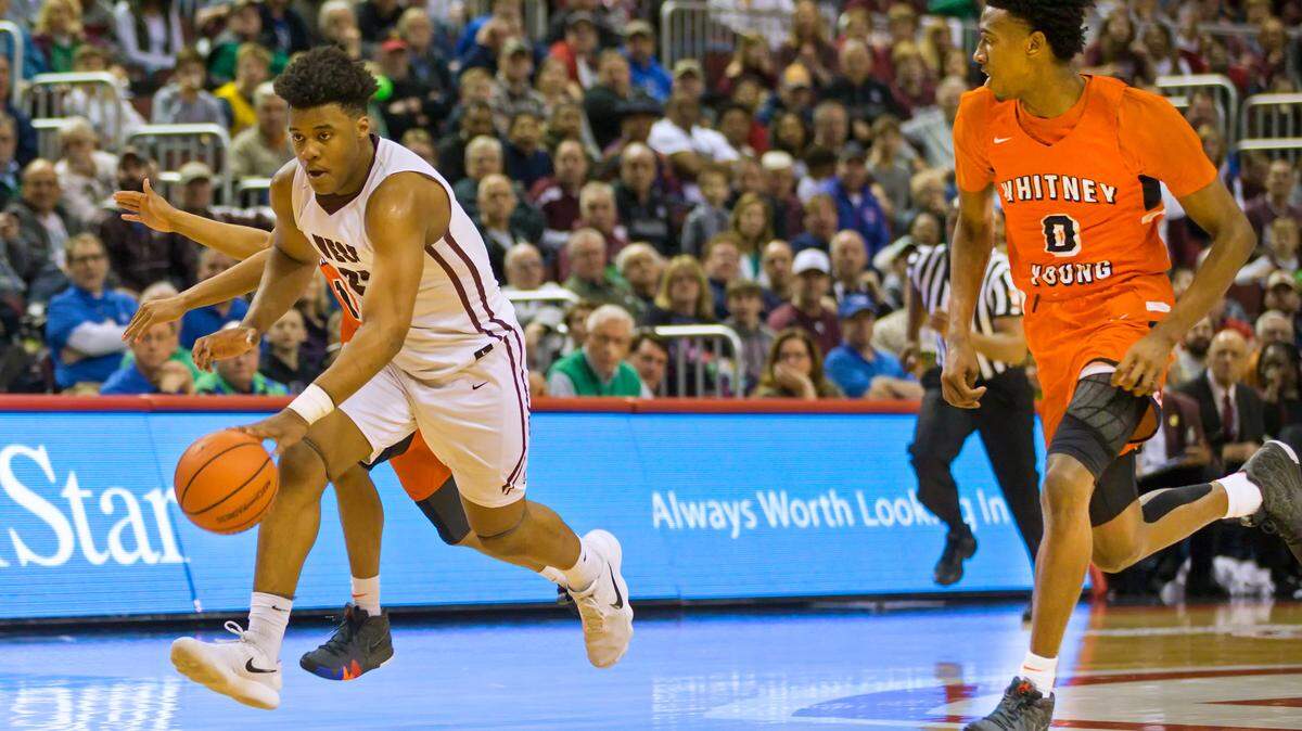 Belleville West’s Keith Randolph Jr. brings the ball up the court during the IHSA Class 4A state championship game last March. Randolph has missed playing time this year as he tended to college football recruiters, then a case of the flu.