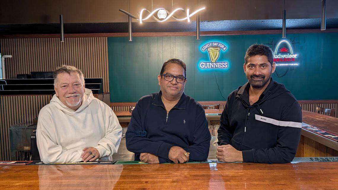 Frank Rickert, Ravi Yedla and Touchdown Bar & Grill owner Jignesh Patel