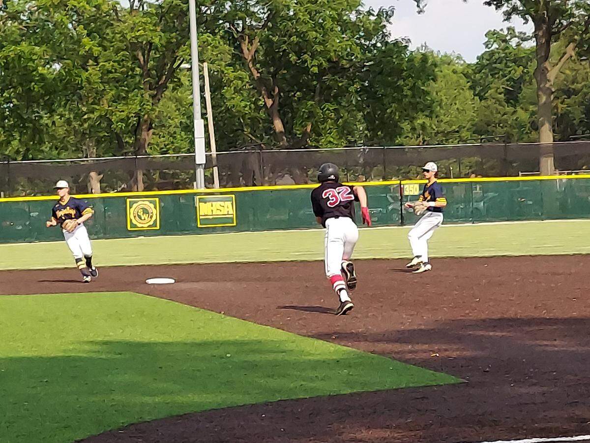 Highland’s Mason Emig takes off for second base on a ground ball hit toward third base during a nonconference game against host O’Fallon on Wednesday, May 17, at Blazier Field. The Panthers ultimately rallied for a 3-2 victory.
