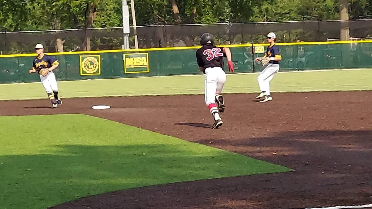 Highland’s Mason Emig takes off for second base on a ground ball hit toward third base during a nonconference game against host O’Fallon on Wednesday, May 17, at Blazier Field. The Bulldogs reached the IHSA Class 3A regional championship game this spring and finished the season at 21-16.