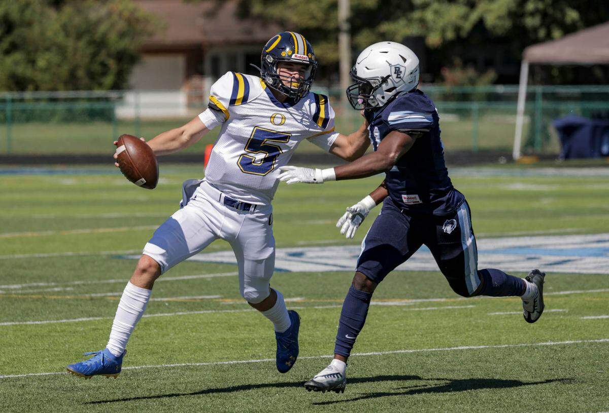 O’Fallon quarterback Colt Michael runs the ball during Saturday’s Southwestern Conference game against Belleville East.