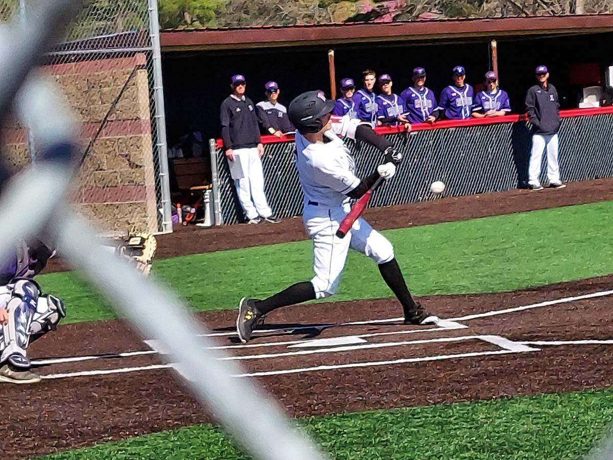 Highland’s Caleb Fohne takes a cut against Mascoutah during a Mississippi Valley Conference game Thursday, April 14, at Triad High School. The Bulldogs held off a late Indians rally to prevail 9-8.