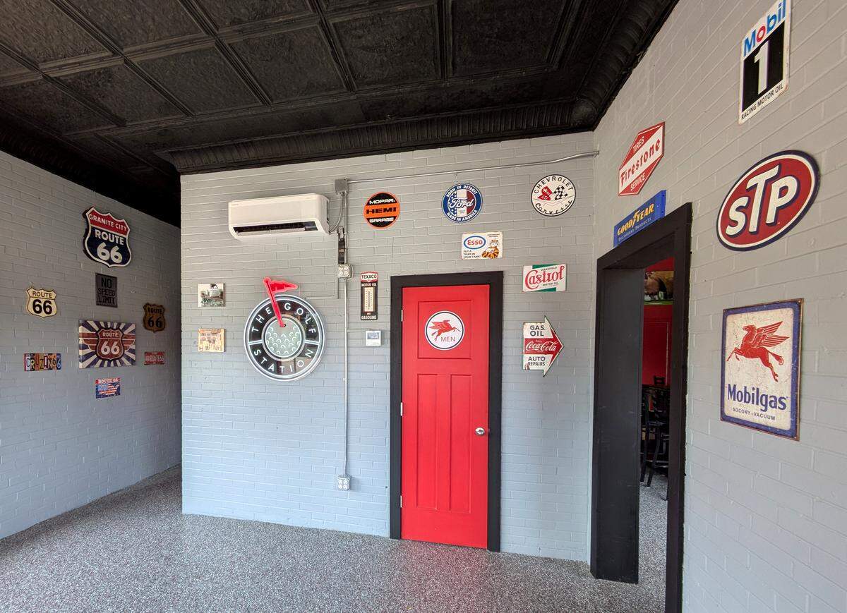 Gas station and Route 66 signage on display at The Golf Station