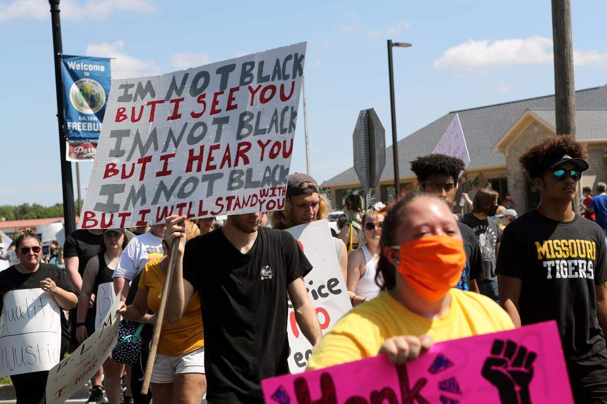 Protesters march through Freeburg Saturday, June 6, 2020.