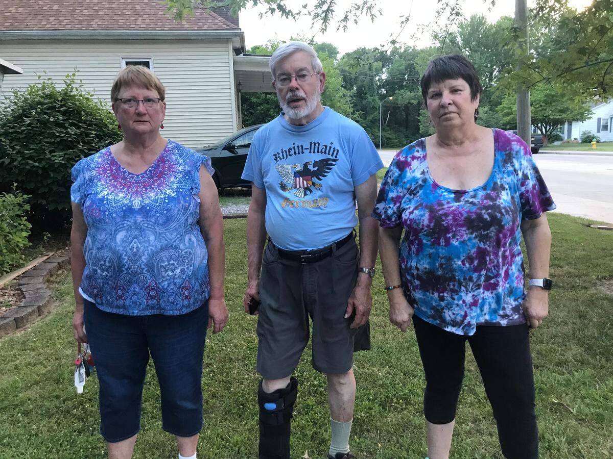 South 17th Street residents, left to right, Mary Eros, Fred Norton and Susan Schneider have grown accustomed to the traffic, accidents, noise and exhaust fumes that a three-lane highway brought to their formerly quiet neighborhood.