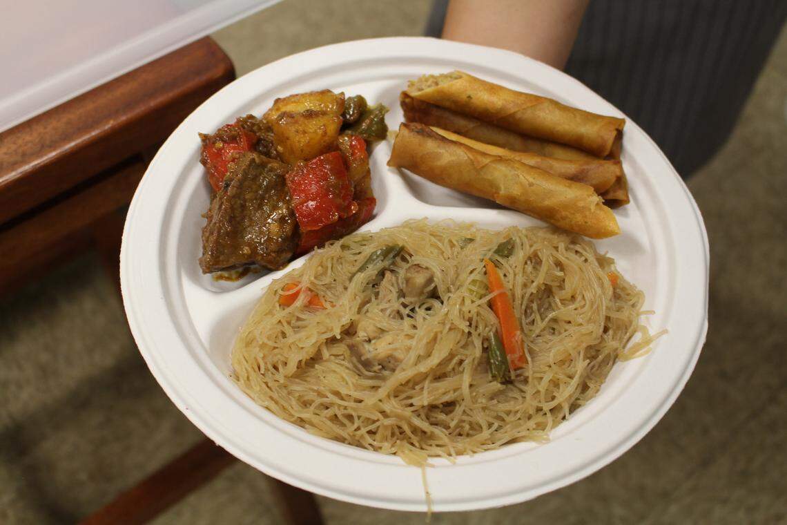 This order at Kain Tayo Filipino Cuisine in Trenton is Mechado (beef stew) with two sides, Lumpia Shanghai (spring rolls) and Pancit (fried rice noodles). The meal costs $7.99.
