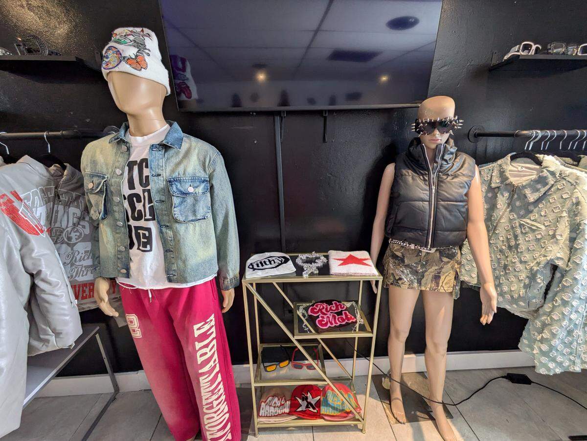 Hats, jackets and branded sweatpants in display at Unforgettable Fittings