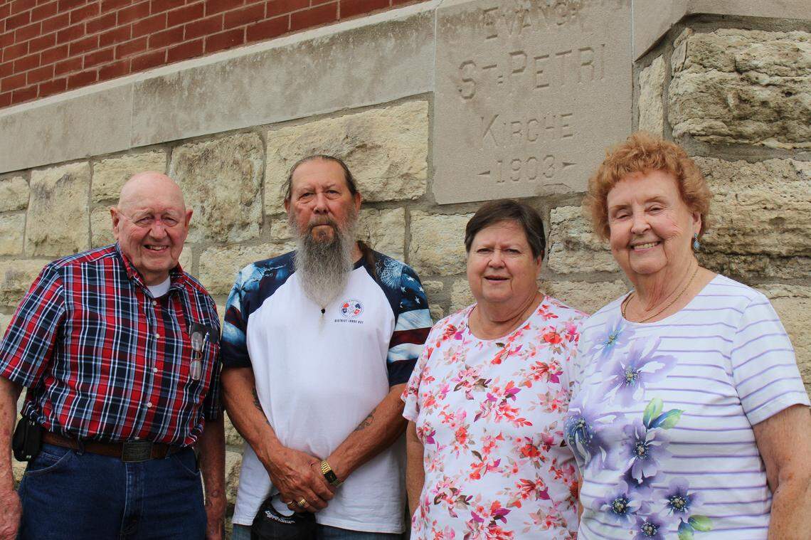 Leadership Team members pose with the 1903 cornerstone (in German) at St. Peter Evangelical United Church of Christ in Granite City. They include, left to right, Bob Braundmeier, Wesley Doolittle, Carolyn Anders and Dorothy Kinney. Not pictured are Carol Braundmeier and Hedy Mees.