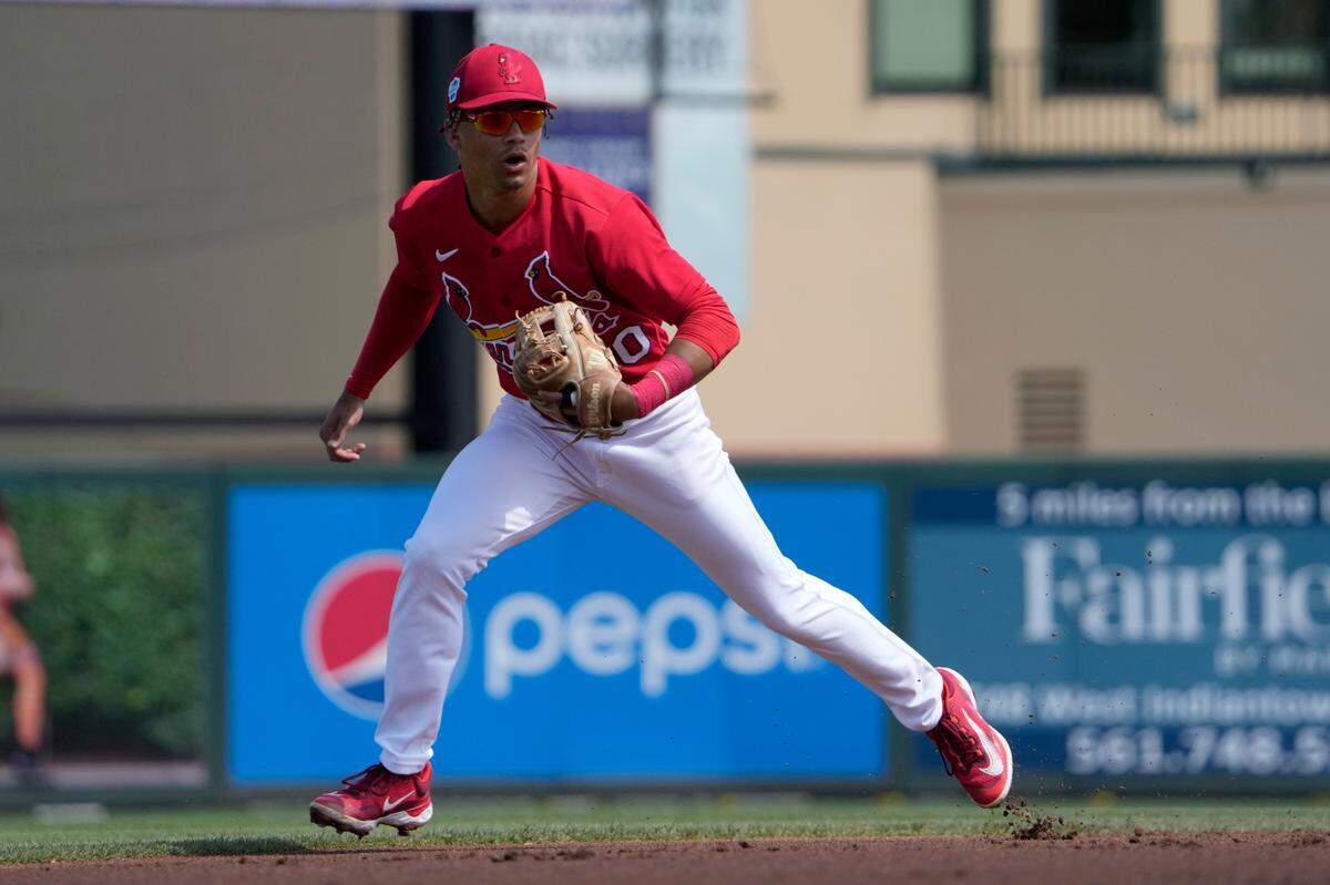 St. Louis Cardinals shortstop Masyn Winn takes up his position during the first inning of a spring training baseball game against the Houston Astros Thursday, March 2, 2023, in Jupiter, Fla. (AP Photo/Jeff Roberson)