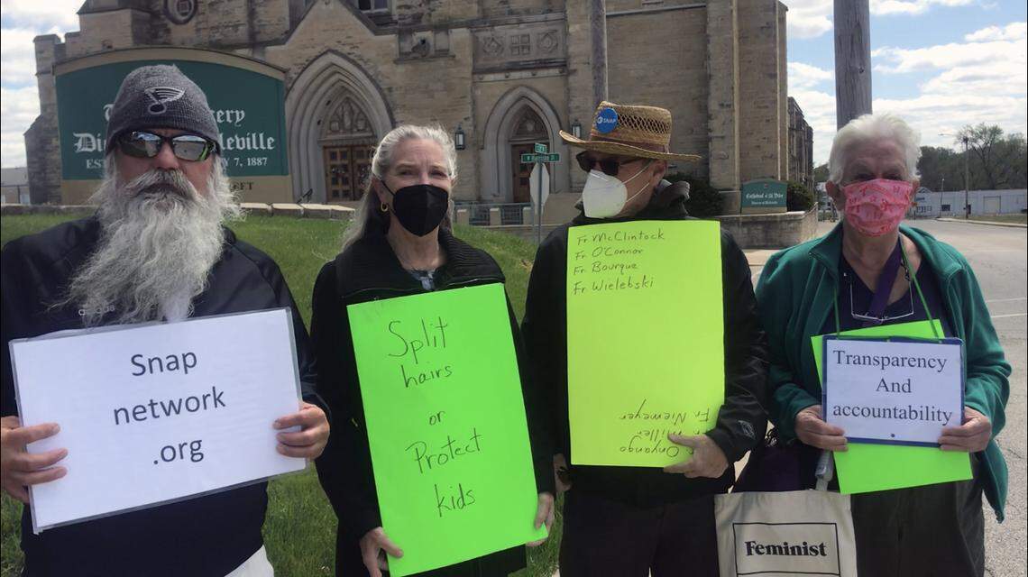 From left to right: John Duffin, Lena Woltering, David Clohessy and Anne Harter hold signs on Thursday, April 15, 2021, outside of the Belleville Diocese headquarters. Duffin, Woltering and Clohessy are members of the Survivors Network of those Abused by Priests, known as SNAP. Harter is a supporter of SNAP and a member of the group the Faithful of Southern Illinois, which sponsors religious education programs.