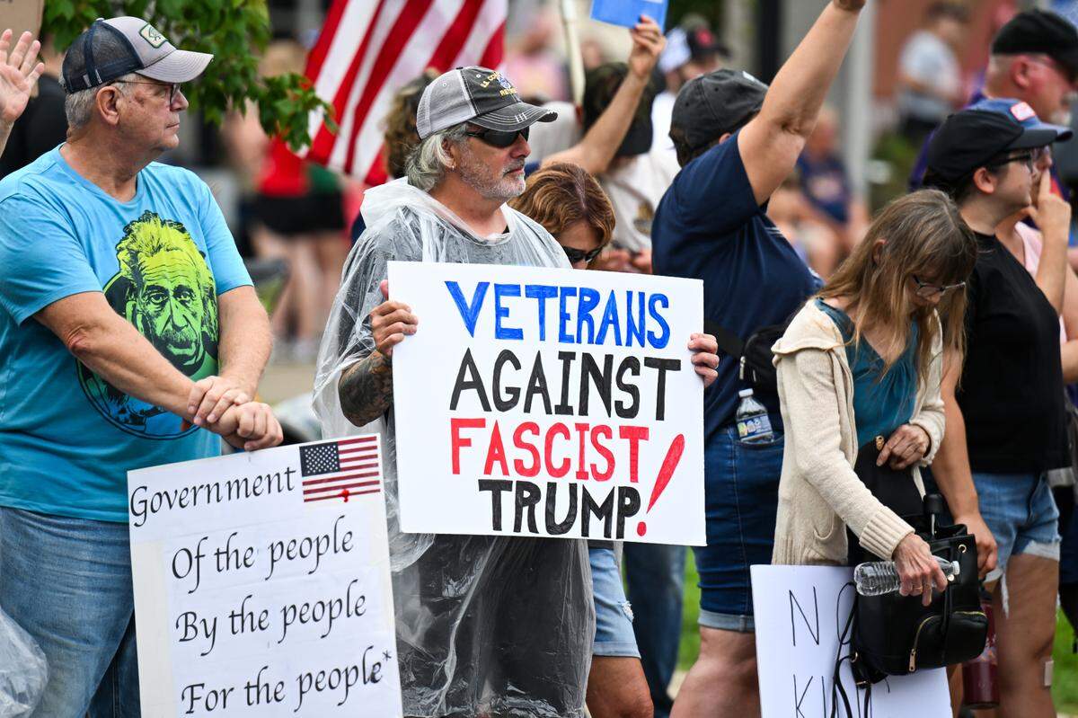 Protesters rally against President Donald Trump at the “No Kings” protest in Belleville’s Public Square Saturday, June 14, 2025.