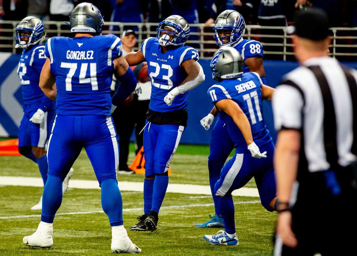 St. Louis Battlehawks running back Brian Hill (23) celebrates a play alongside his teammates on Sunday during the Battlehawks’ XFL home opener against the Arlington Renegades at the Dome at America’s Center in downtown St. Louis. Hill rushed for a team-leading 89 yards on just 18 carries and caught two passes for 26 more yards in helping lead the Battlehawks to a 24-11 victory.