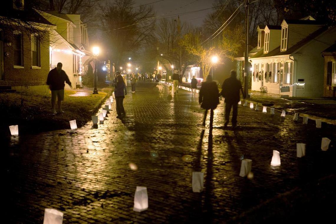 A crowd walks Garfield Street in Historic Belleville. The Old Belleville Historical Luminary Walk welcomed the public to Abend and Garfield Streets in historic Belleville in December 2015. Visitors enjoyed house tours, refreshments and entertainment at the Garfield Saloon, strolling carolers, and over 1000 luminaries.