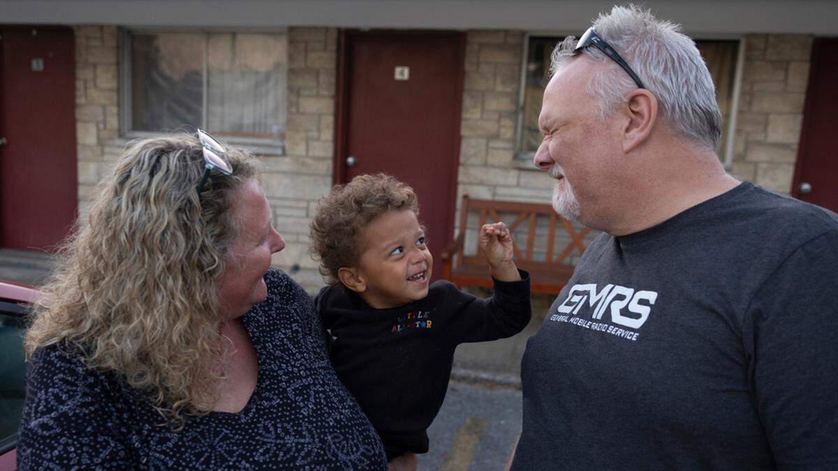 Heather and Stephen Casner play with Royce Lingle, 2, during pickup time at the day care center the Casners started in a former motel in rural Anna, Illinois.