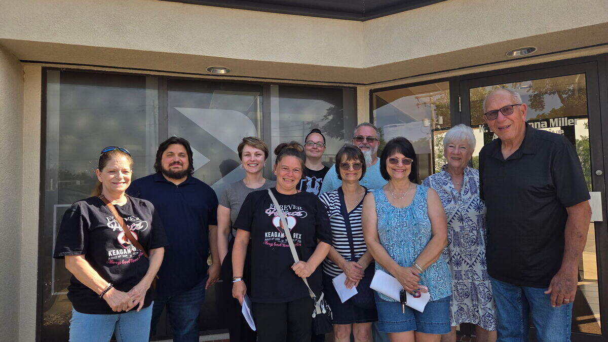 The family of Keagan Rex and other supporters beam after Belleville Township High School District 201 approves new protocol for honoring deceased seniors at graduation ceremonies.