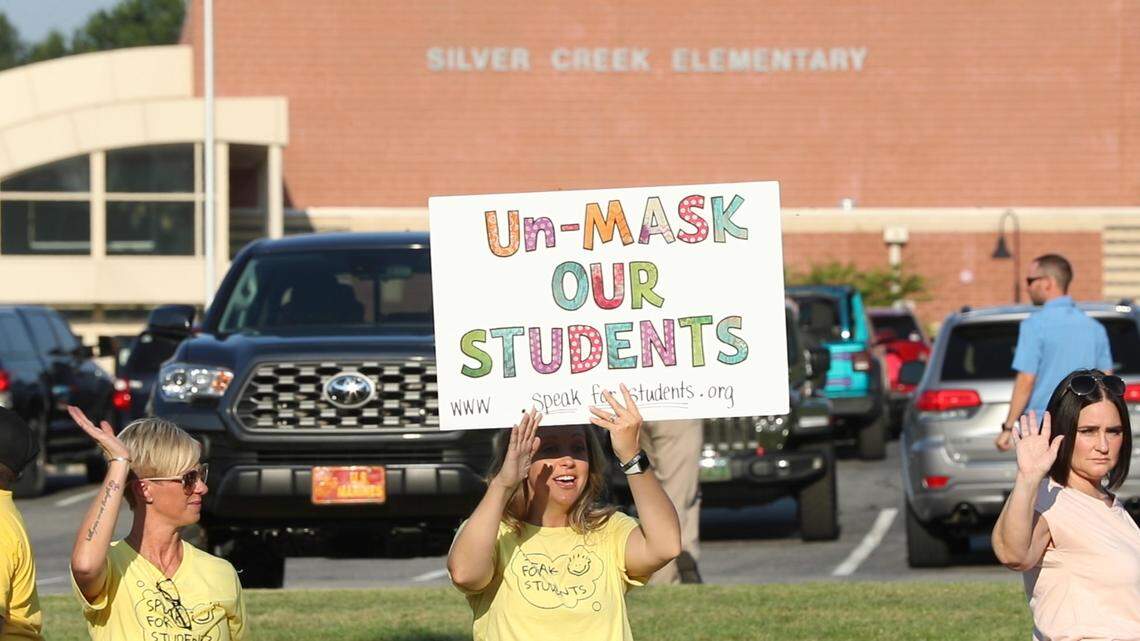 Parents and Speak for Students members rally July 26, 2021, outside Silver Creek Elementary in Troy, Illinois, ahead of a Triad Unit 2 School Board meeting. On Wednesday, parents from 145 Illinois school districts filed a class-action lawsuit over mask requirements.