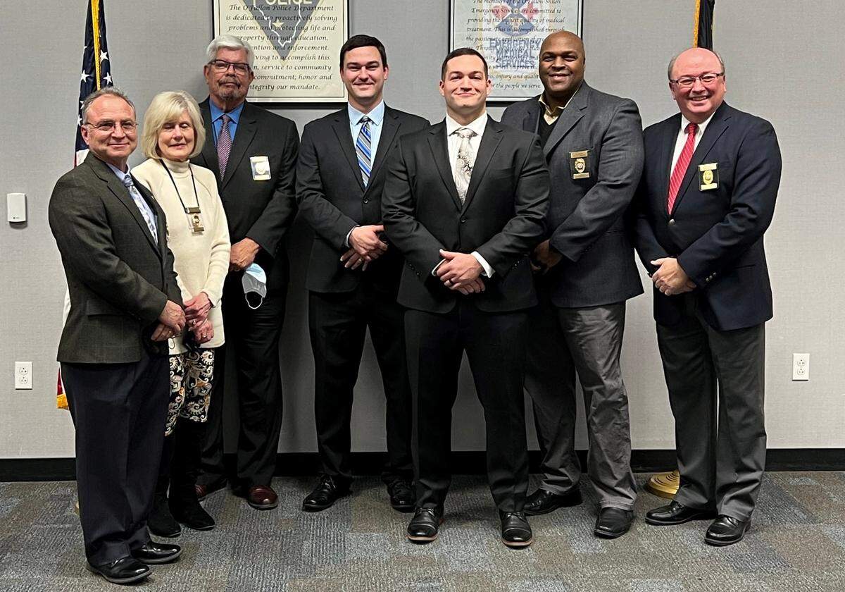 Scott Voltrain and Will Carter were sworn in as O’Fallon Police Department officers Jan. 3. From left, Police Commissioners Ed Martinez, Susan Holden and Scott Battoe; Voltrain; Carter; and Commissioners Calvin Brown and Russ Thoman.