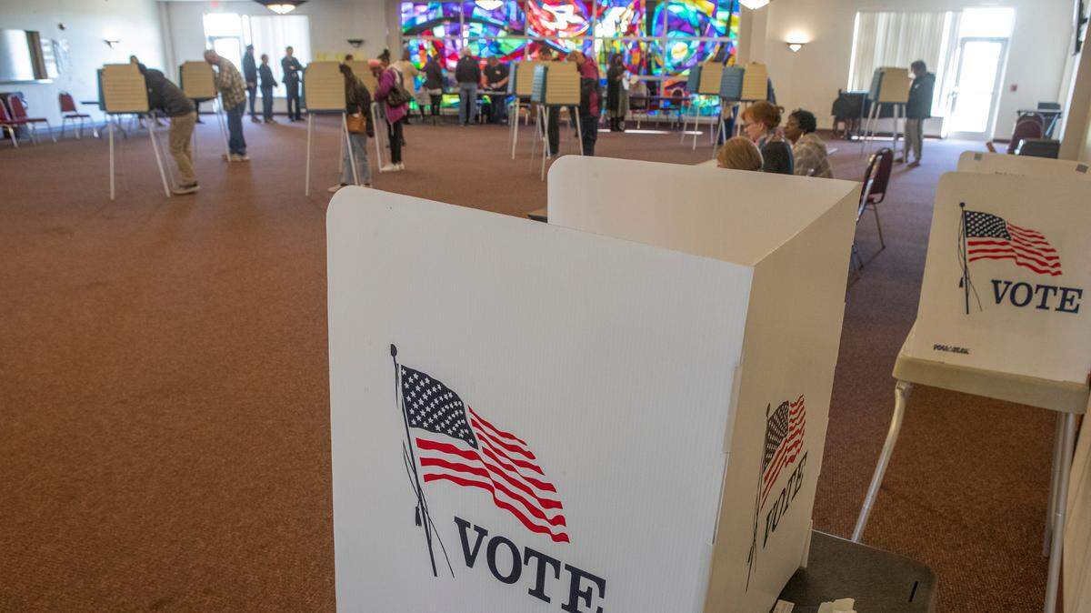 A steady stream of voters filled most of the voting booths at the Holy Trinity Catholic Church polling place in Fairview Heights, Illinois during the November 2022 election.