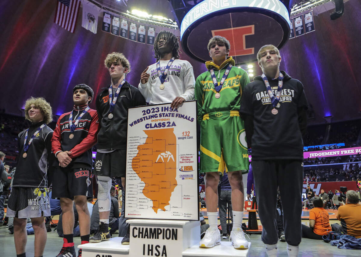 Mascoutah’s Santino Robinson stands atop the podium at the 2023 IHSA Individual Wrestling State Finals on Saturday.