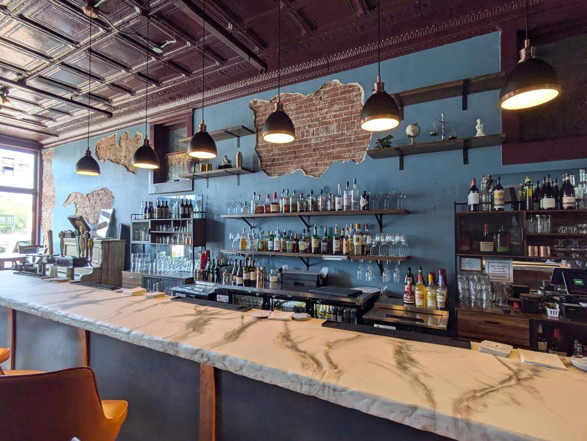 The bar top at The Upright is made from a composite material patterned like marble with a different texture.