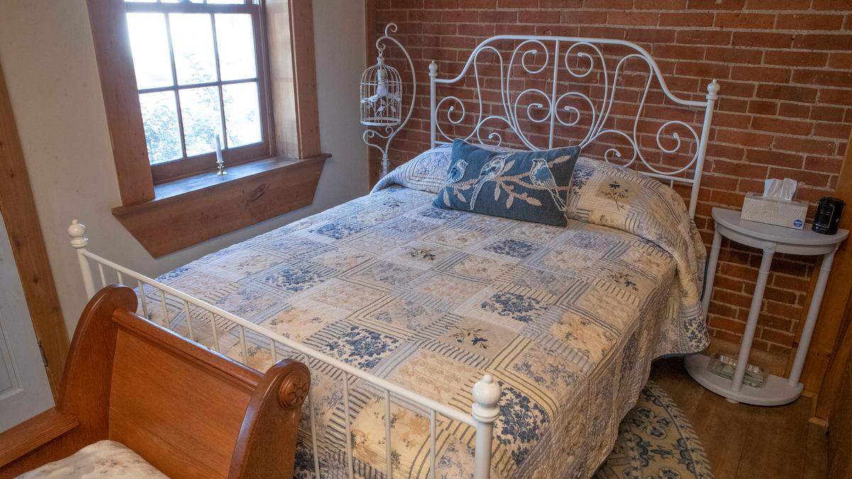 An Airbnb at 626 E. Garfield in Belleville has exposed brick walls, a private garden with gazebo, one bedroom, one bathroom, a kitchen with dishes, pots and pans and a living room with Roku TV, games and puzzles.