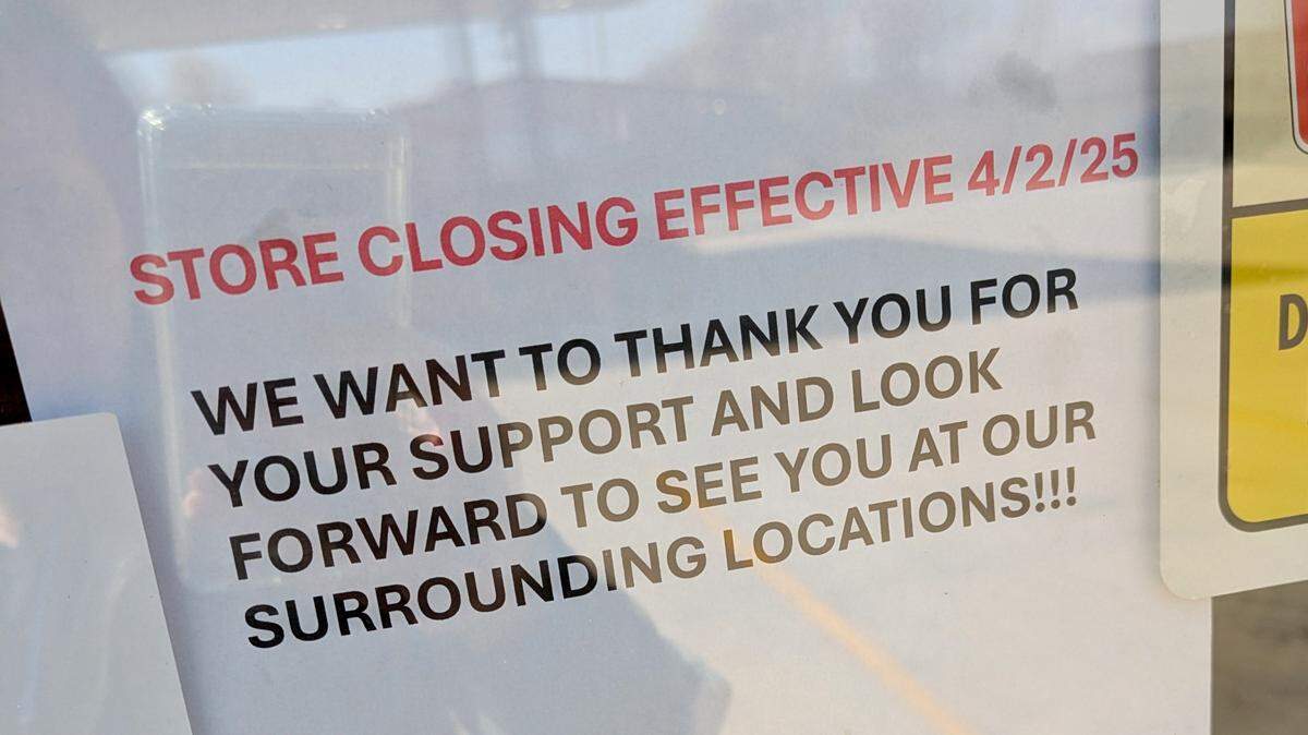 Flyers announcing the closing are posted on the store’s doors and windows.