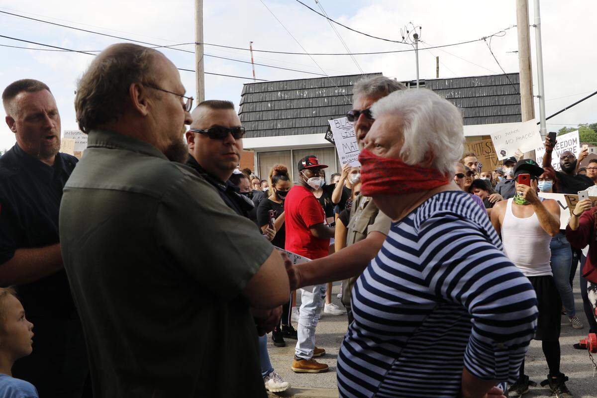 Two Anna natives, Jeff Barnes, 51, and Linda Lafoon, 75, face off about their opinions regarding the Black Lives Matter protest during a protest on June 4, 2020. Barnes, left, said the protest didn’t need to happen, while Lafoon said she’s glad Anna is facing its past.