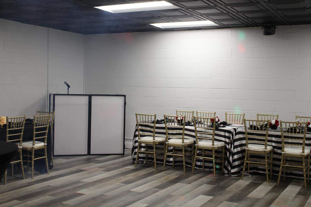 The upstairs party room at Events at The U. has a D.J. booth with a wireless mic, a professional sound system, fog machine and strobe lights.
