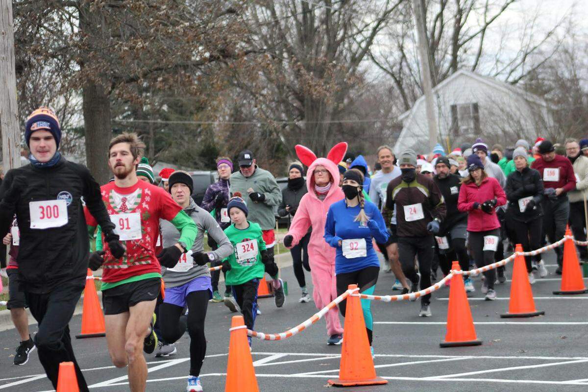 Runners participates in the annual Holiday Hilltop 5K Run/Walk in Shiloh. Event Director Neil Jansen said over $280,000 has been raised during the past 10 years to benefit a young person battling a challenging medical condition.