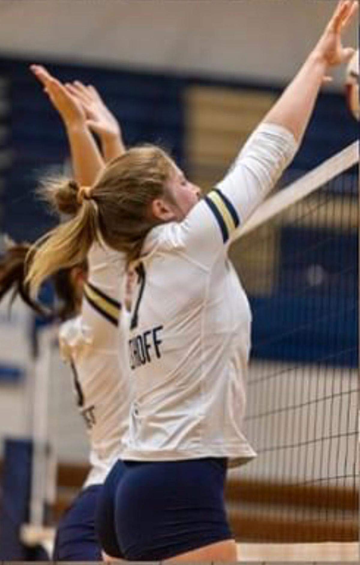Althoff sophomore Gabby Orlet rises for the block shot during a match last fall. Orlet, who is battling a rare form of cancer, was recently awarded as the IHSA’s nominee for the Spirit of Sport Award. The IHSA selected Orlet from a pool of more than 250 candidates and she received the award Wednesday morning.
