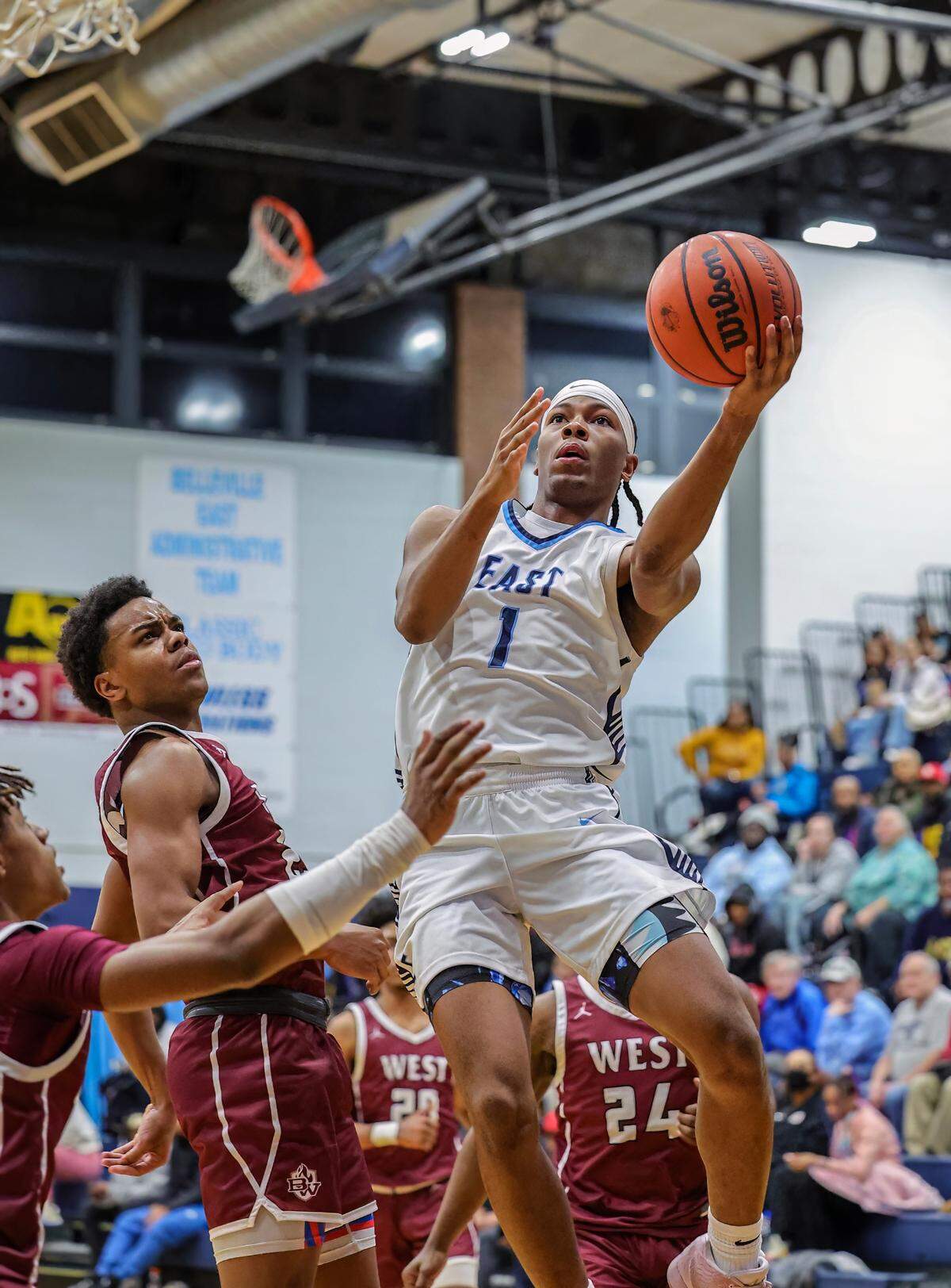 Belleville East’s Jordan Pickett goes to the basket during the Chick-fil-A Classic championship game against Belleville West. The Lancers ultimately posted a 57-52 victory.