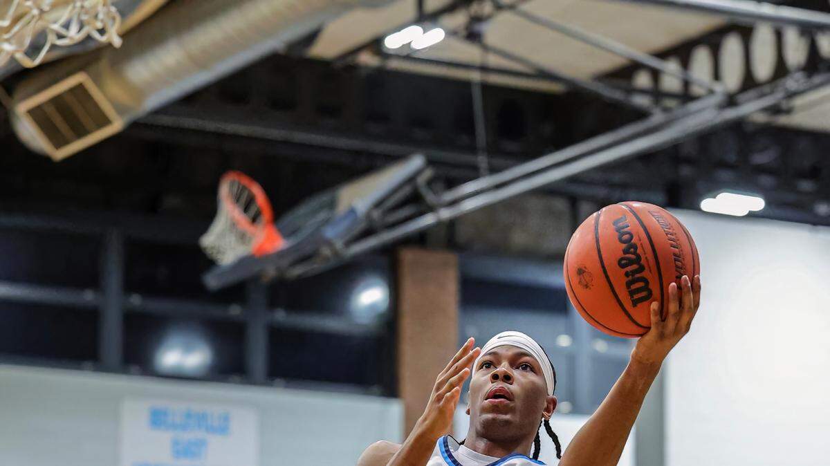 Belleville East’s Jordan Pickett goes to the basket during the Chick-fil-A Classic championship game against Belleville West last month. The Lancers and Maroons were both back in action over the weekend.