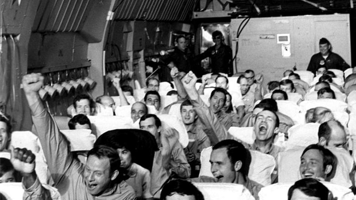 Ex-POWs are on a flight about to be reunited with family members in February 1973.