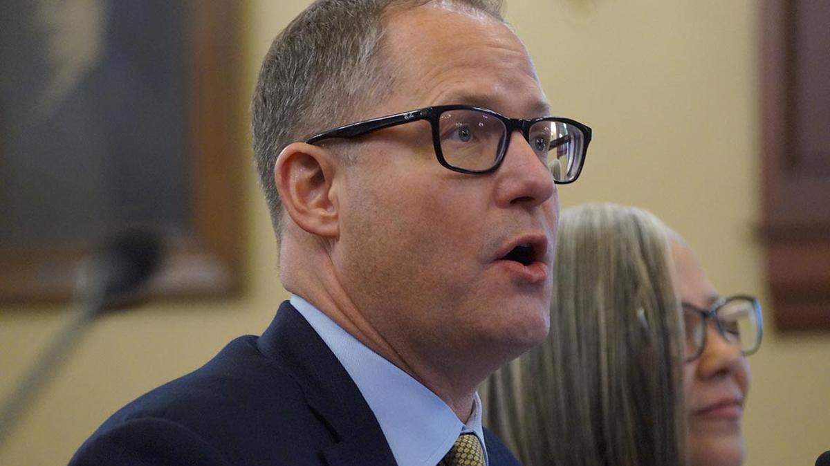 A.J. Wilhelmi, CEO of the Illinois Health and Hospital Association, responds to questions from state lawmakers in Springfield.
