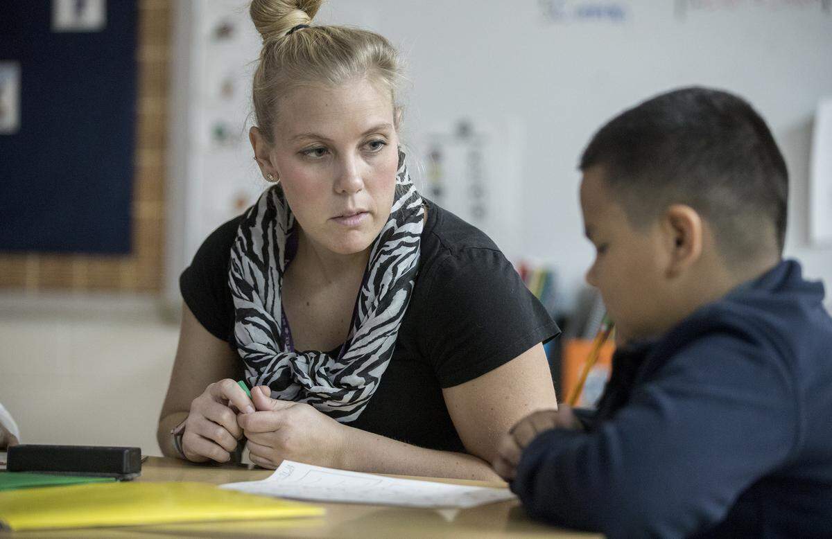 Hollywood Heights kindergarten through fourth-grade special education teacher Lindsey Rakowski works with a student during a one-on-one session. Nominated by the Collinsville School District, Rakowski was one of 102 educators from the St. Louis metropolitan region to be honored at Emerson’s 30th annual Excellence in Teaching Award ceremony.