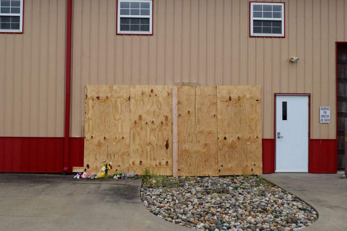 The spot where a Jeep ran through the wall of the after-school program was boarded up Tuesday.