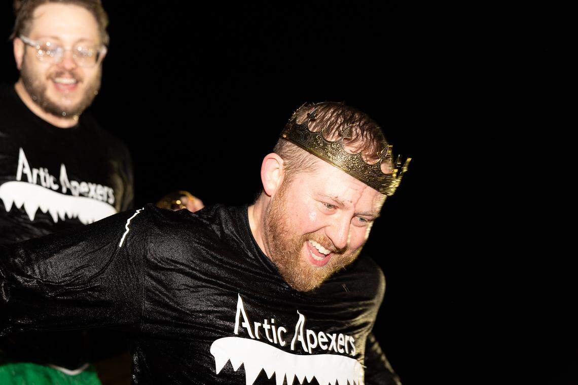 “Artic Apexers” Dave Elliff and Michael Lockenvitz emerge from the dumpster after taking a leap in support of the Polar Plunge in Collinsville Friday. Donning tutus and crowns, the pair were part of a larger group from Apex Network Physical Therapy.