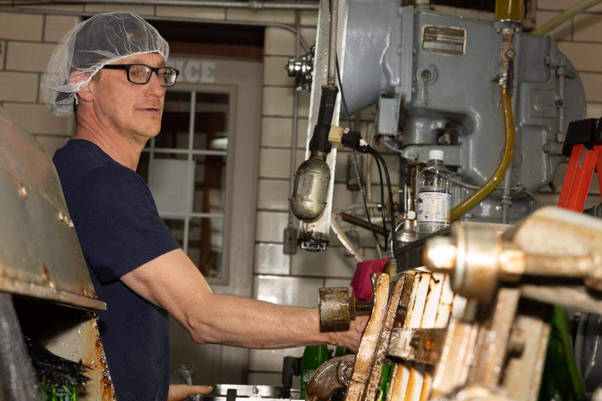 Excel Bottling Company’s Breese location features a 1940s bottle recycler, where customers can take in used bottles and have them clean and refilled in the facility.
