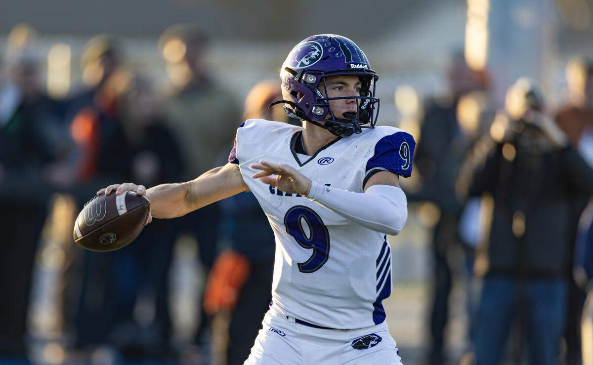 Breese Central sophomore quarterback Owen Kehrer looks for a receiver in a IHSA Class 4A state football semifinal game in Rochester Saturday.